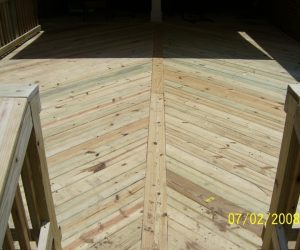 Wooden patio deck with a chevron pattern and railings on either side, dated July 2, 2008.